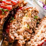 Slice of meatloaf stuffed with mozzarella cheese.