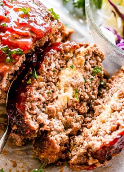 Slice of meatloaf stuffed with mozzarella cheese.