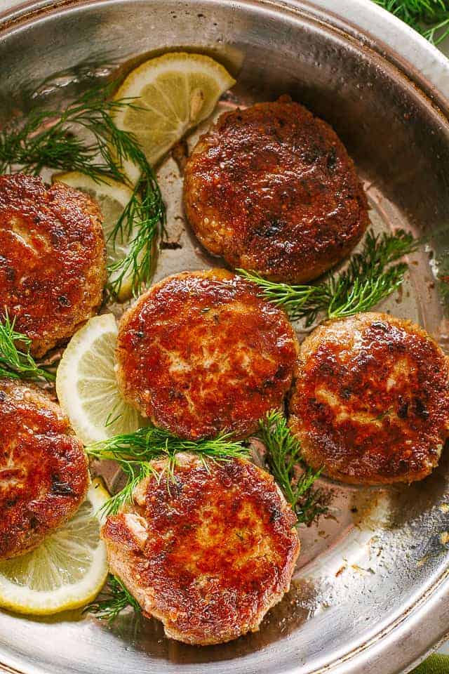 Salmon patties on baking sheet.