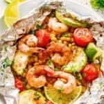 Photo of shrimp and veggies in a foil packet with the recipe title in a text overlay.
