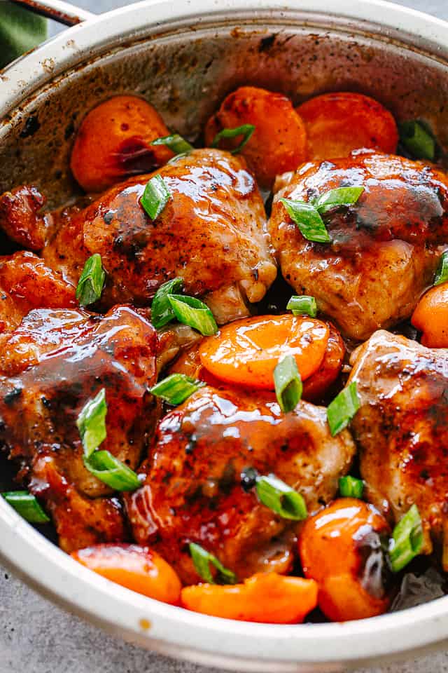 Cooked chicken thighs with apricots and barbecue sauce.