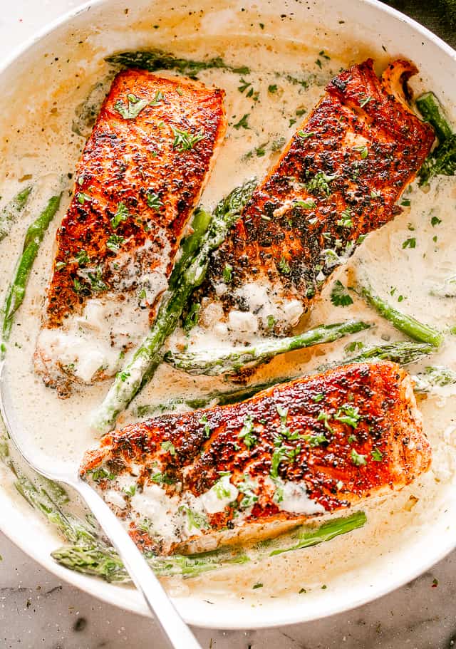 Salmon Fillets with Cream Sauce in a Skillet