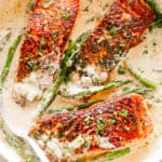 Salmon Fillets with Cream Sauce in a Skillet