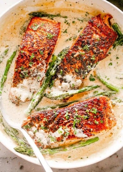 Salmon Fillets with Cream Sauce in a Skillet