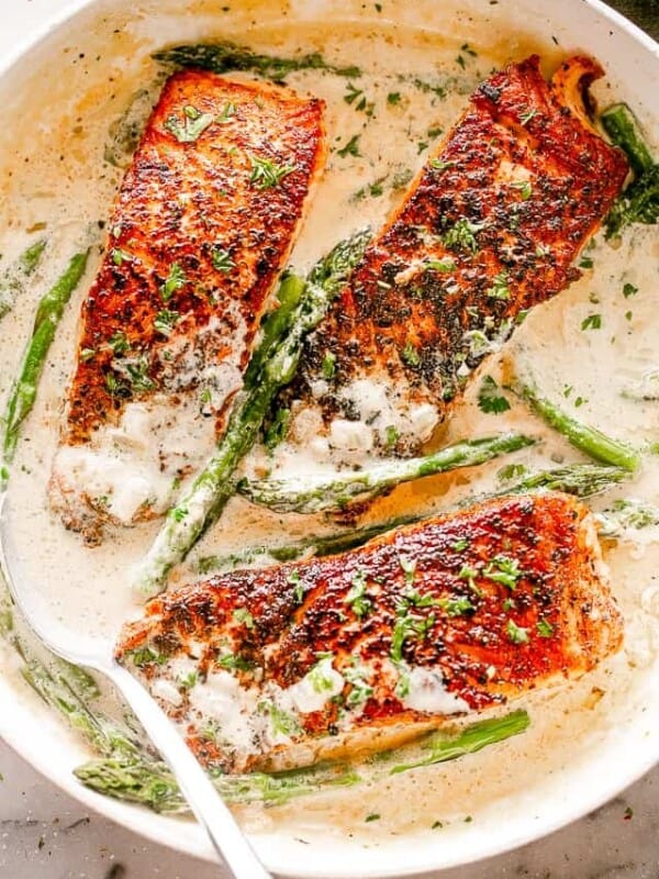 Salmon Fillets with Cream Sauce in a Skillet