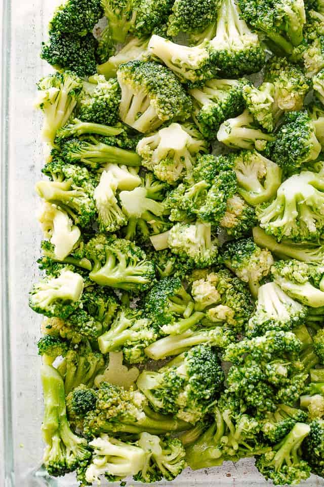 Broccoli florets in a baking dish.