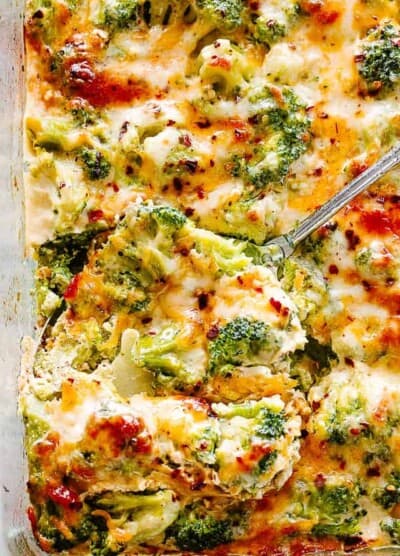 Broccoli Cheese Casserole with a serving spoon.