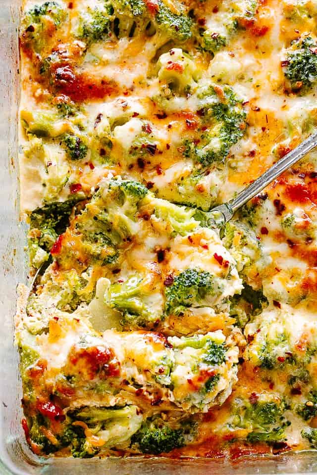 Broccoli Cheese Casserole with a serving spoon.