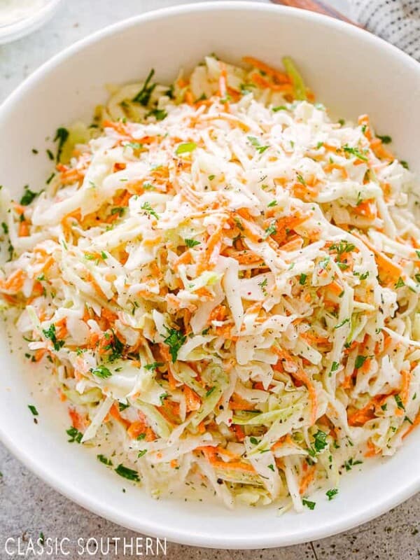 Coleslaw in a white salad bowl.