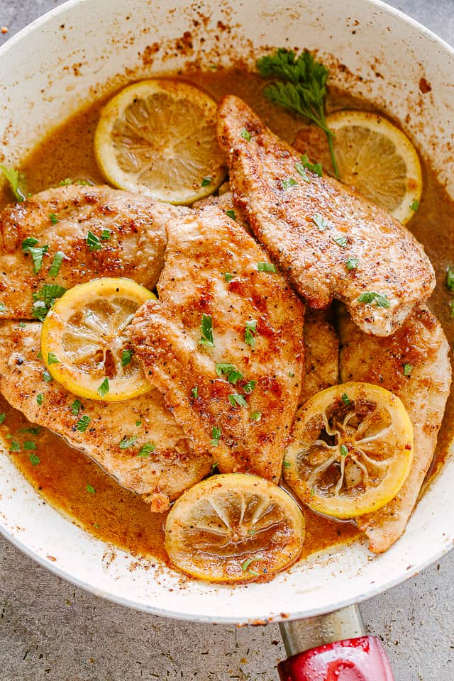 Juicy Lemon Pepper Chicken cooked in one skillet and finished with a buttery garlic and lemon sauce. A quick 30-minute chicken dinner. Lemon pepper chicken breasts in a skillet.
