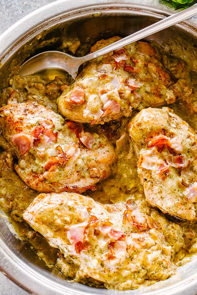 Baked Pesto Alfredo Chicken in a skillet.