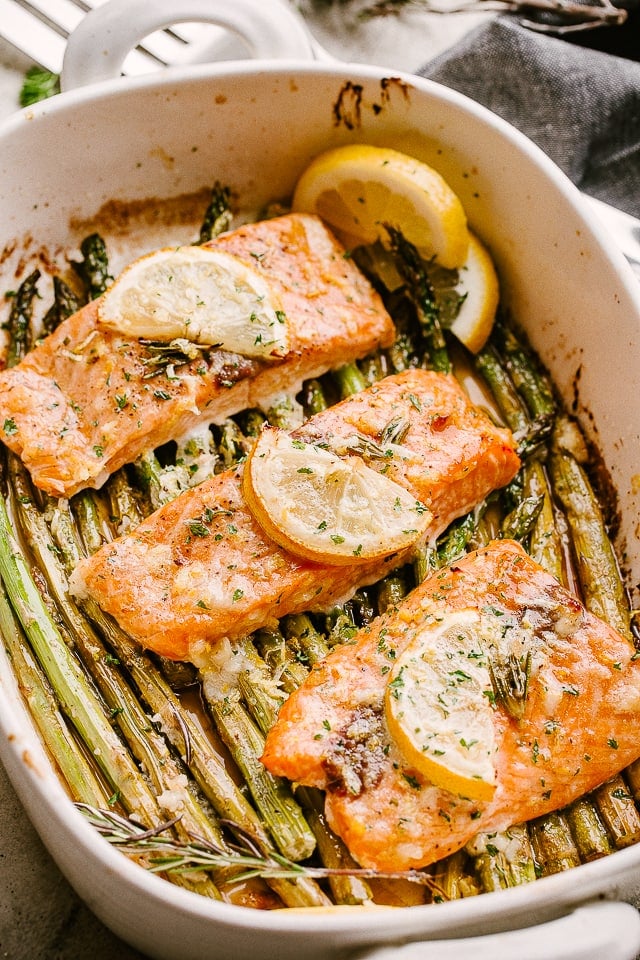 Salmon and asparagus in a baking dish.