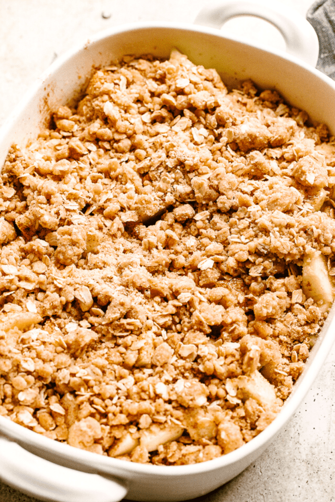 an oat mixture sprinkled over diced apples.