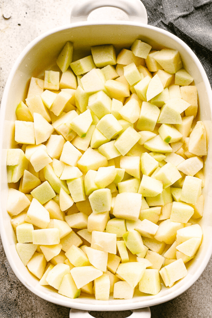 diced apples in a white baking dish
