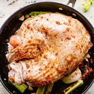 top view of raw turkey breast cooking in a skillet