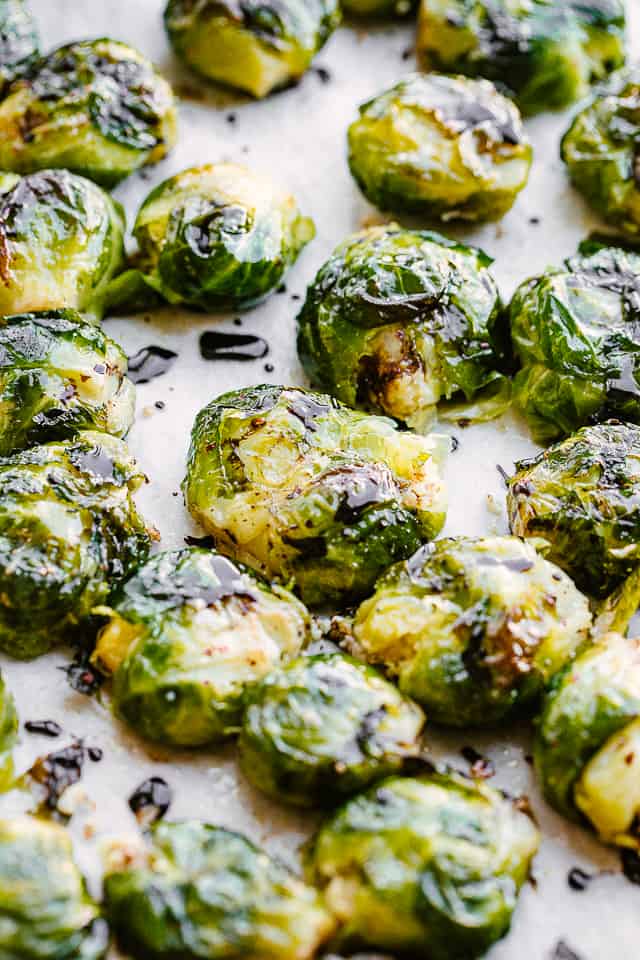 Close-up image of smashed brussel sprouts on a baking sheet