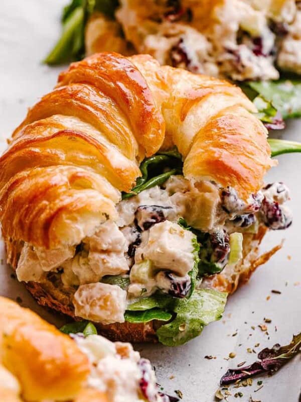 Turkey salad served with a croissant.