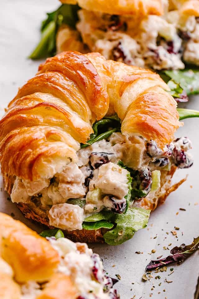 Turkey salad served with a croissant.