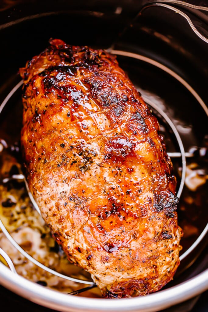 Cooked turkey breast on an Instant Pot trivet.