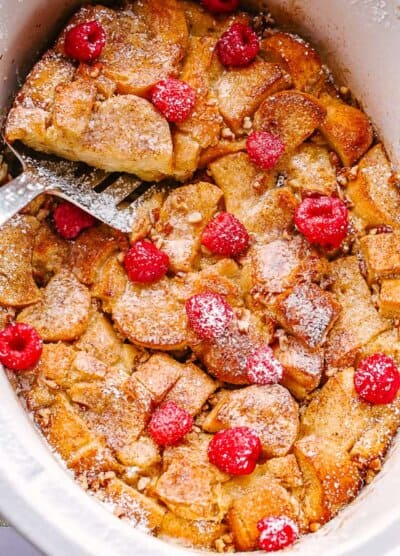 french toast topped with raspberries and powdered sugar