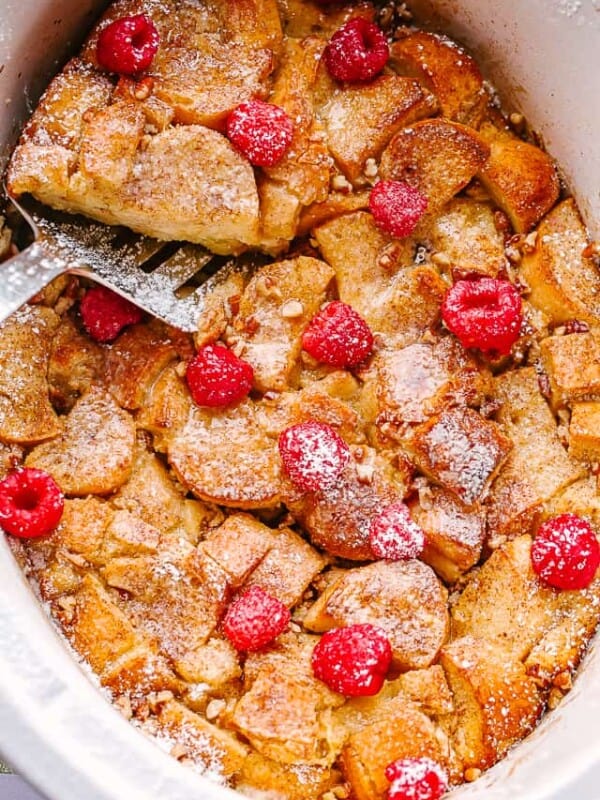 french toast topped with raspberries and powdered sugar