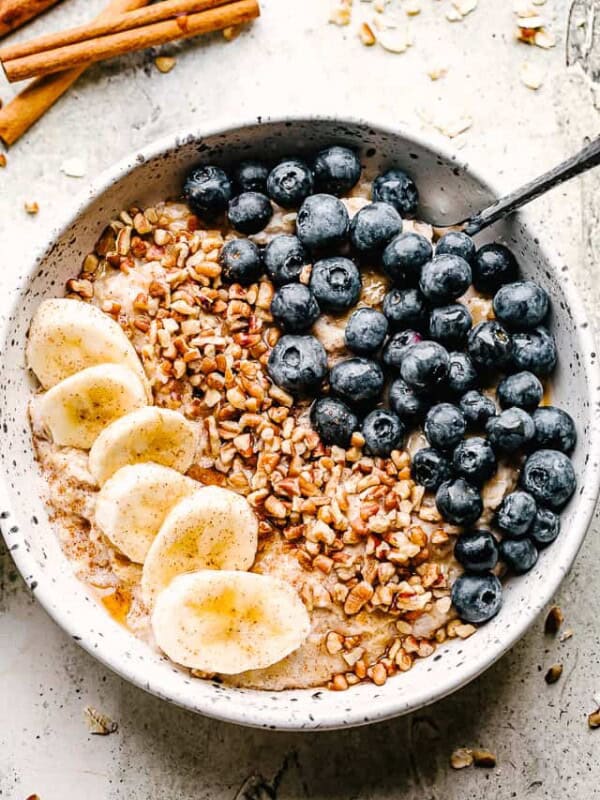 bowl of homemade oatmeal topped with berries and nuts