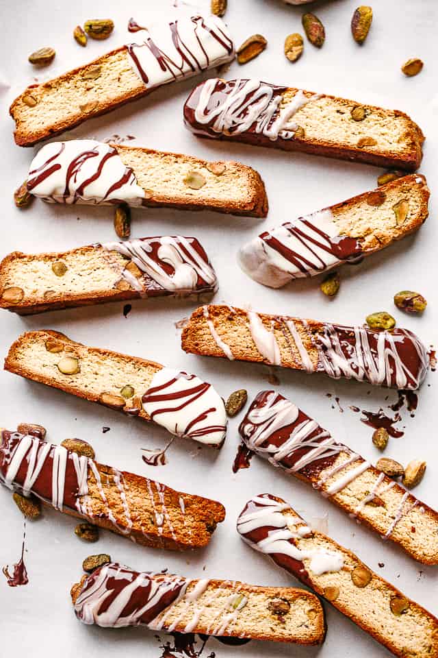 pistachio biscotti arranged on a parchment paper