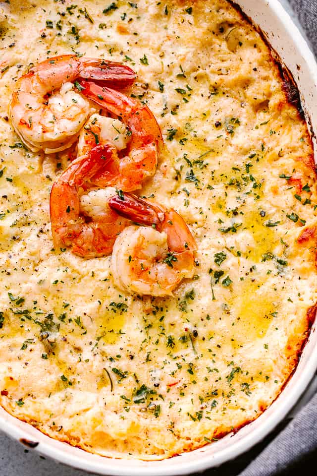 Hot shrimp dip topped with cooked shrimp.