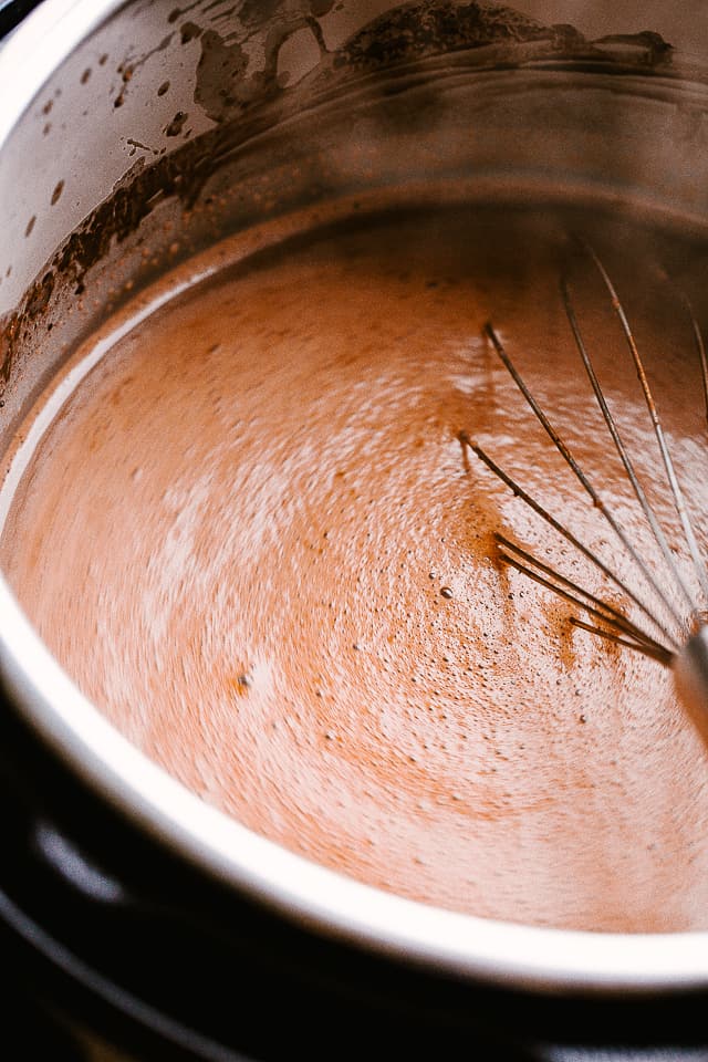 whisking chocolate in the crock pot