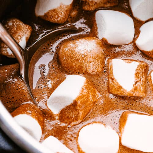 hot chocolate in the slow cooker topped with marshmallows