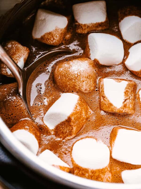 hot chocolate in the slow cooker topped with marshmallows