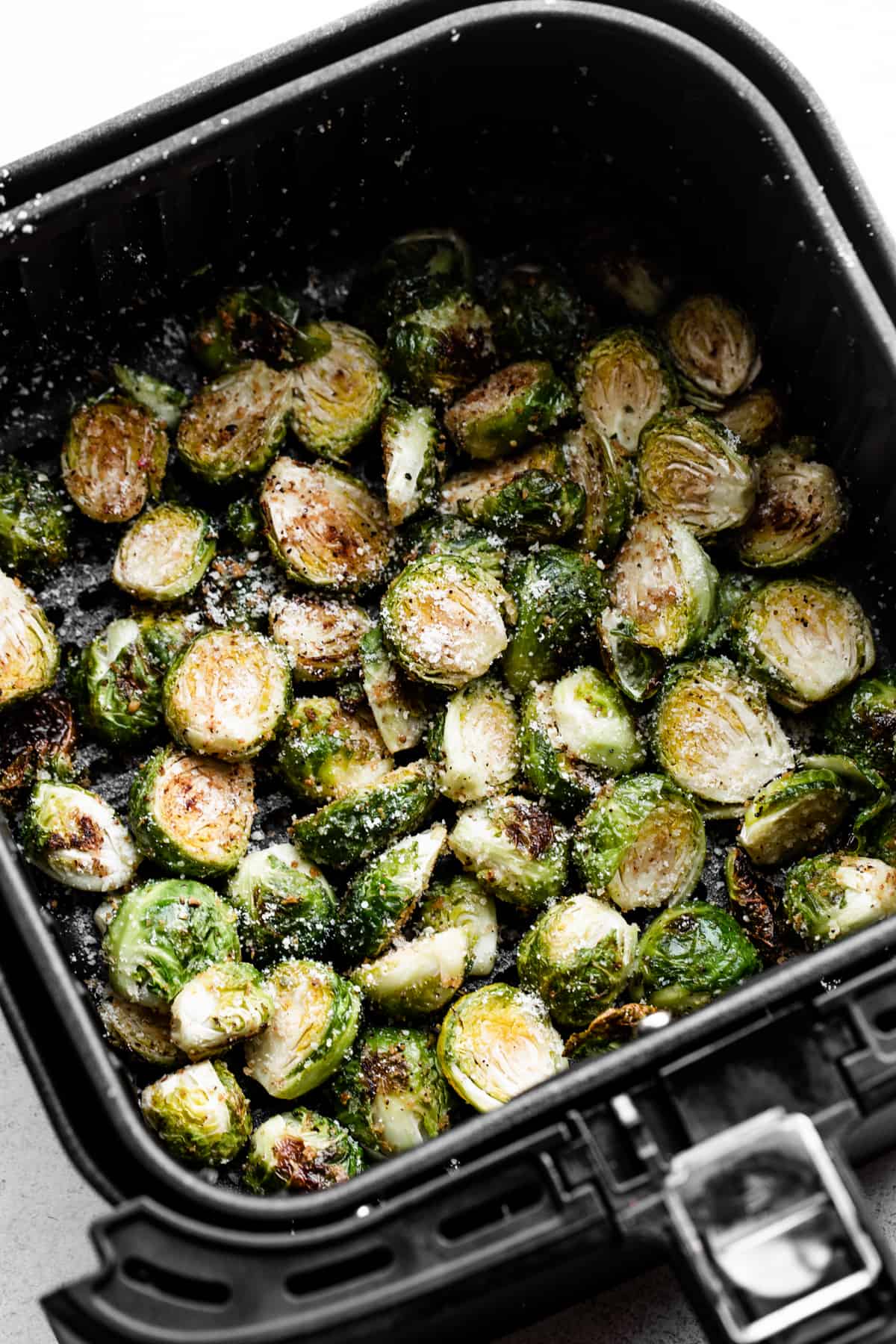 Air fryer brussels sprouts in an air fryer basket