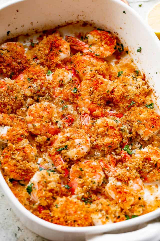 Baked shrimp scampi in a baking dish.