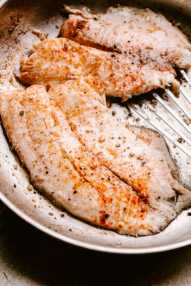 raw fish in a pan