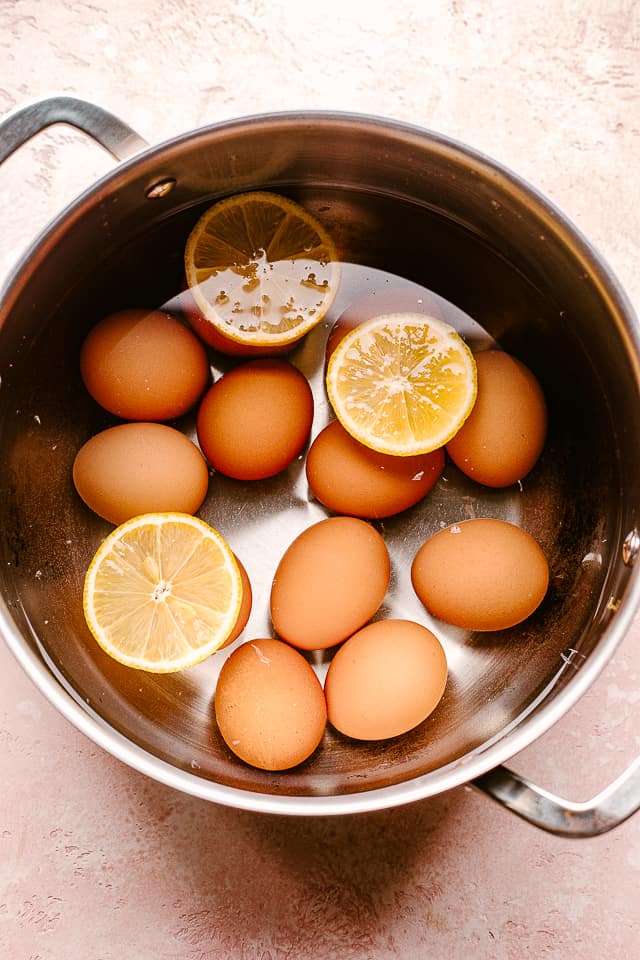 boiling brown eggs in a pot
