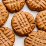 Peanut butter keto cookies arranged on a pan.