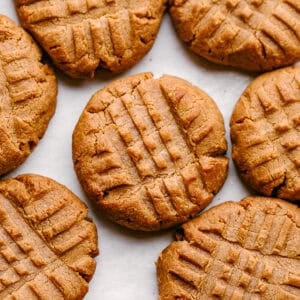Peanut butter keto cookies arranged on a pan.