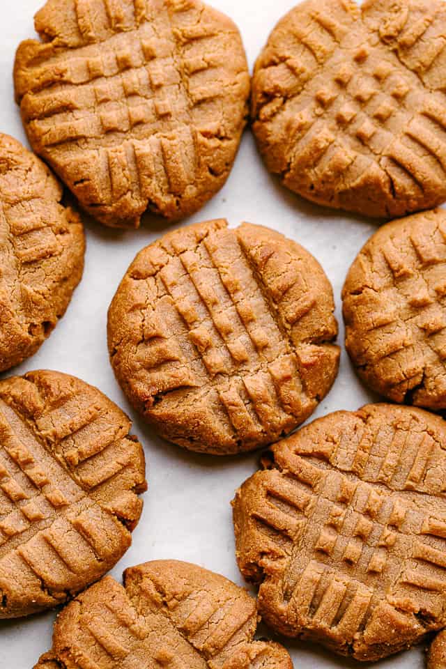 Peanut butter keto cookies arranged on a pan.