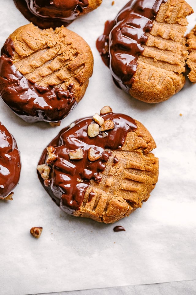 Baked peanut butter cookies dipped in melted chocolate.