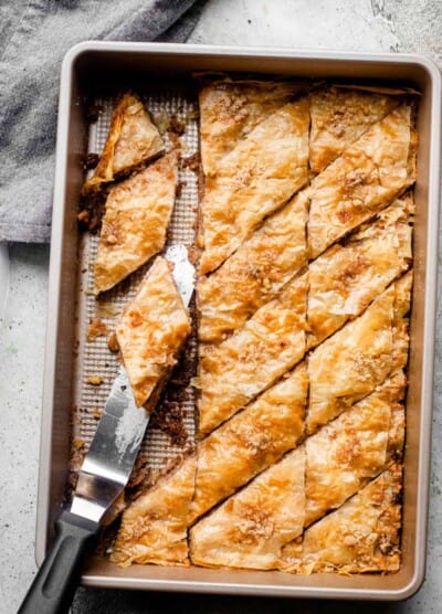 Slices of homemade baklava in a baking dish