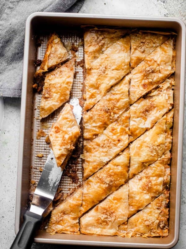 Slices of homemade baklava in a baking dish