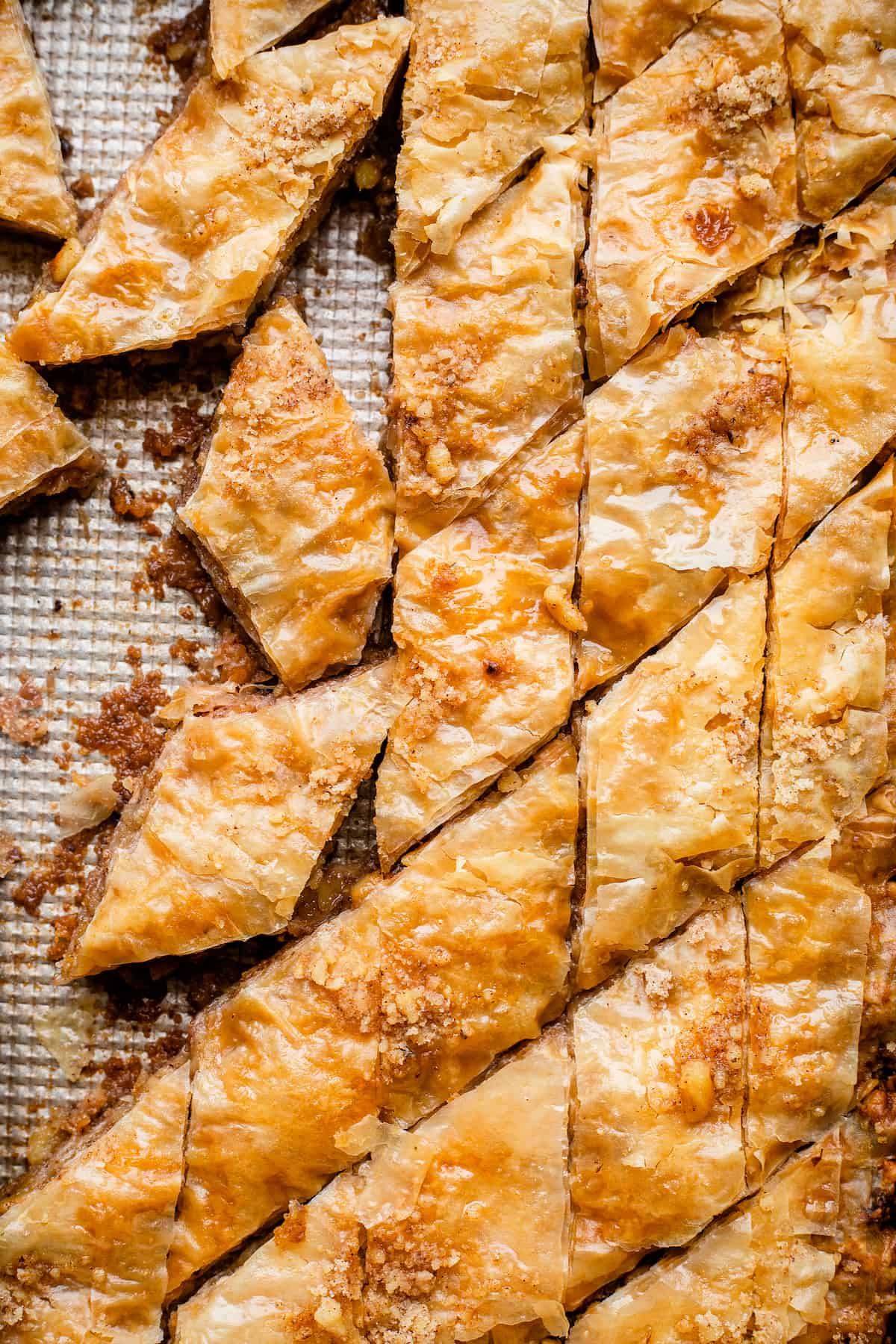 Slices of baklava on a baking sheet