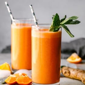 Immunity boosting smoothie served in a glass and garnished with mint