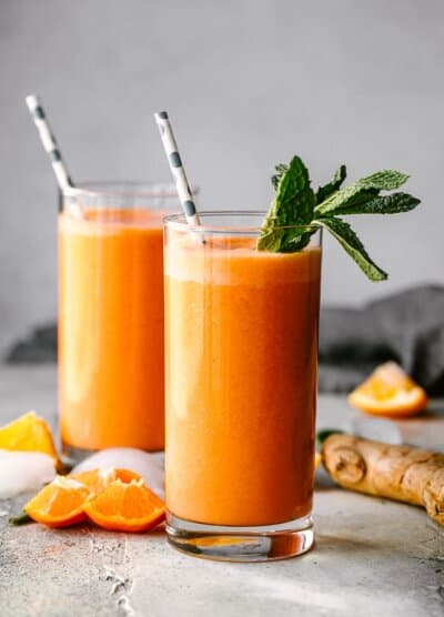 Immunity boosting smoothie served in a glass and garnished with mint