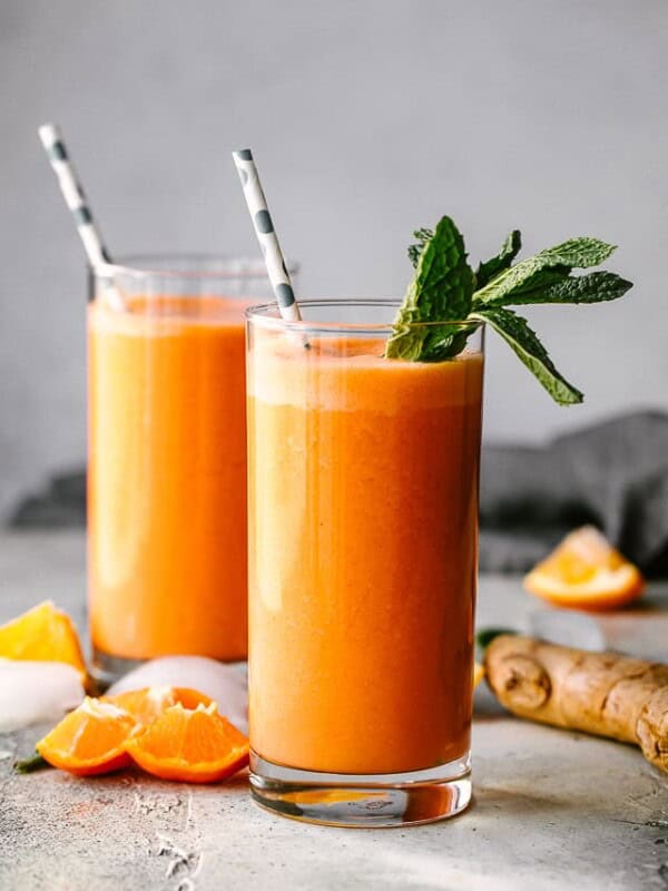 Immunity boosting smoothie served in a glass and garnished with mint