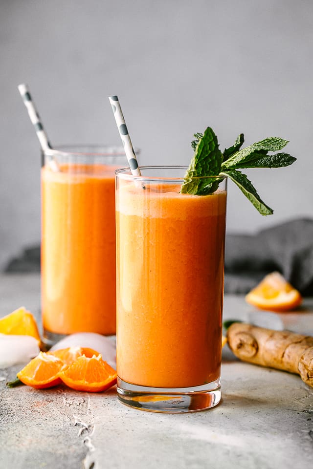 Immunity boosting smoothie served in a glass and garnished with mint