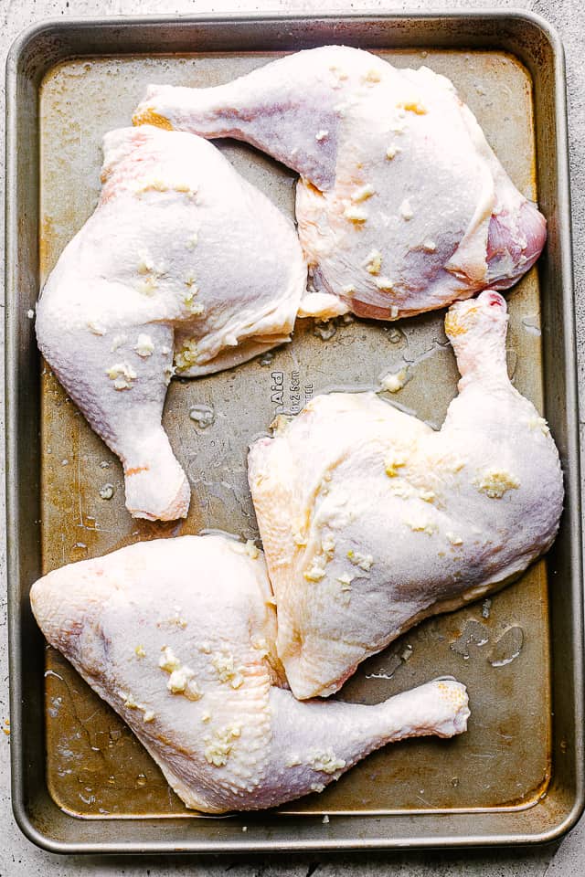 Chicken legs covered in lemon juice and garlic. 