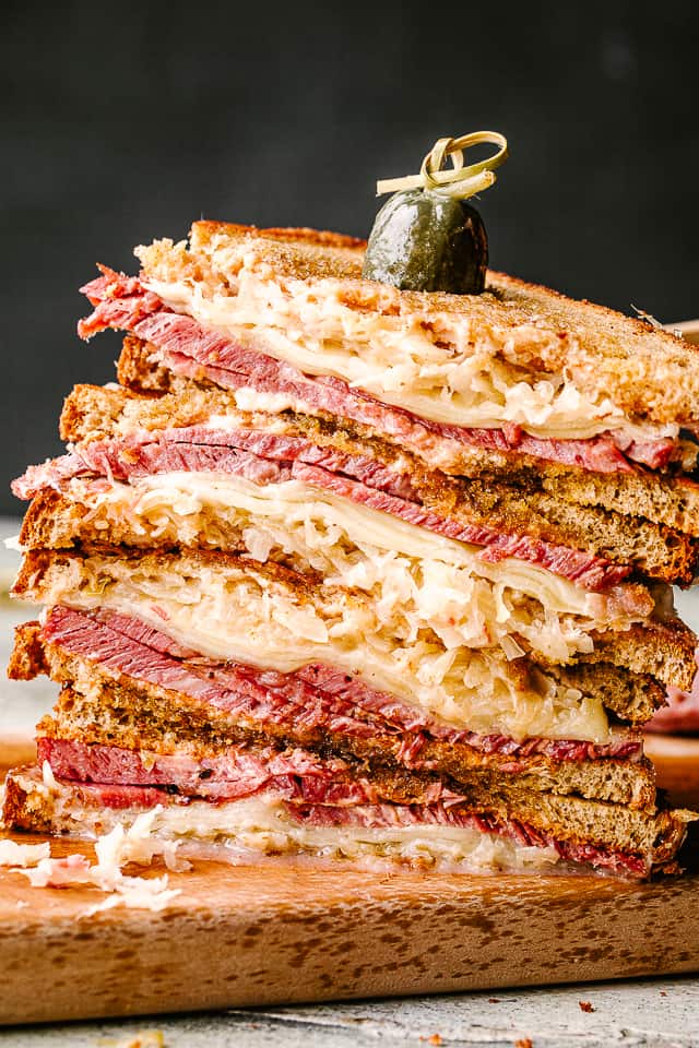 Stack of sliced reuben sandwich slices.