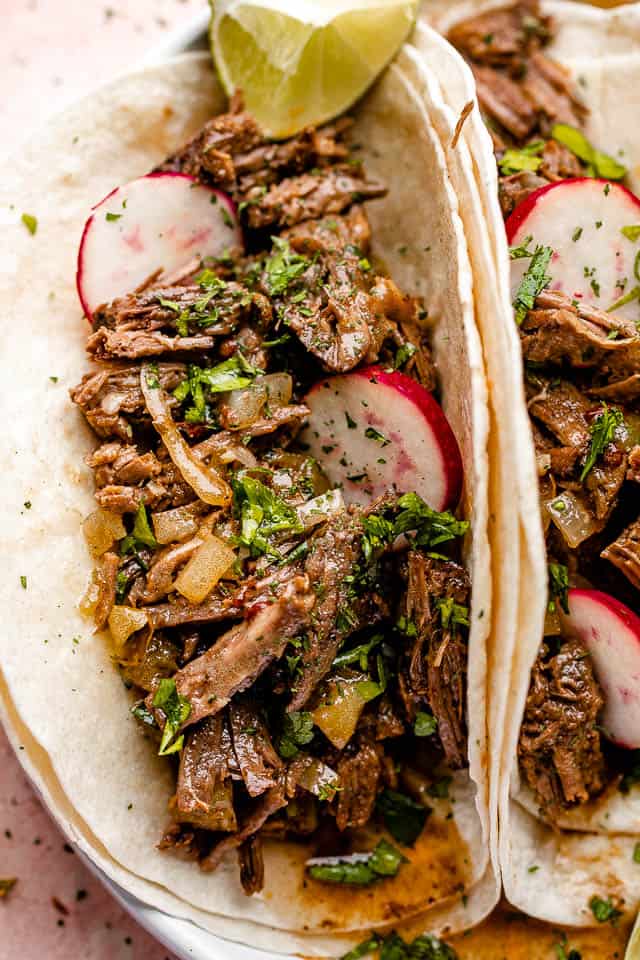 barbacoa beef tacos with radishes