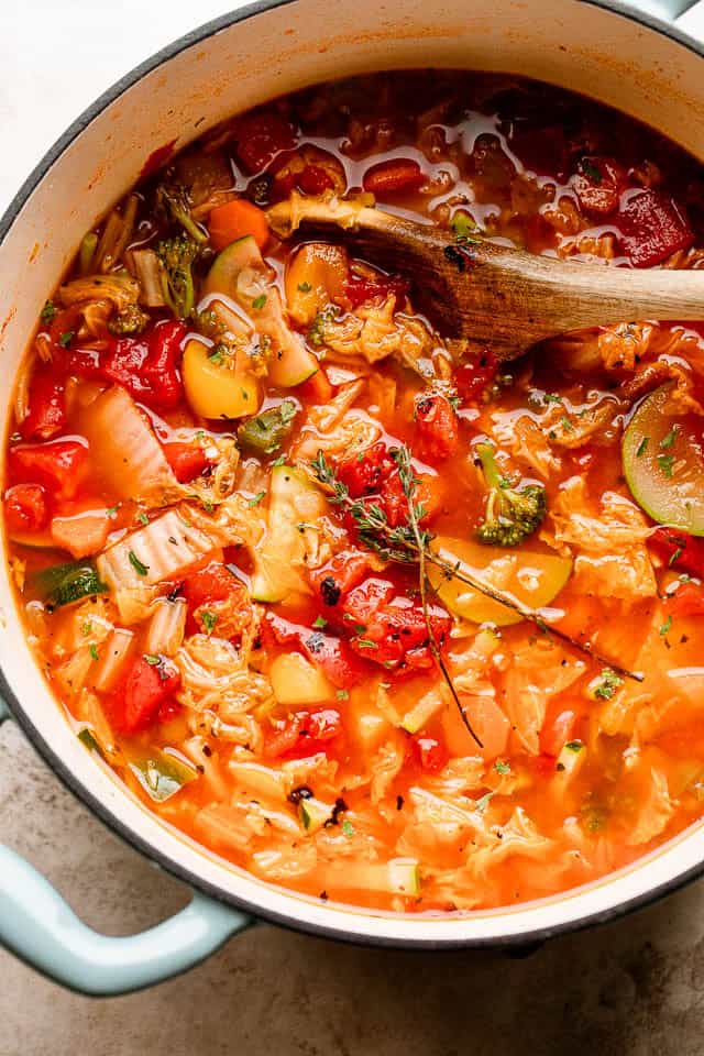This easy cabbage soup recipe is packed with tender veggies simmered in a flavorful tomato broth. It’s hearty, delicious, and ready in 30 minutes! Cabbage soup simmering in a pot.
